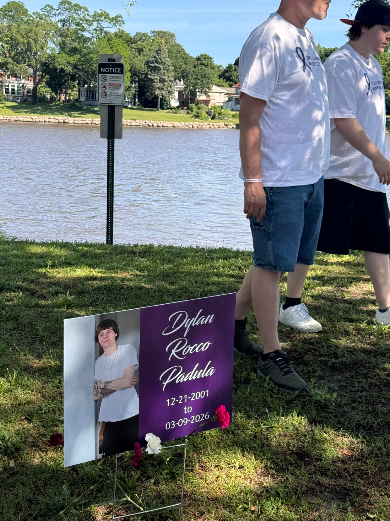 Memorial sign for Dylan Rocco Padula at the lakeside walk