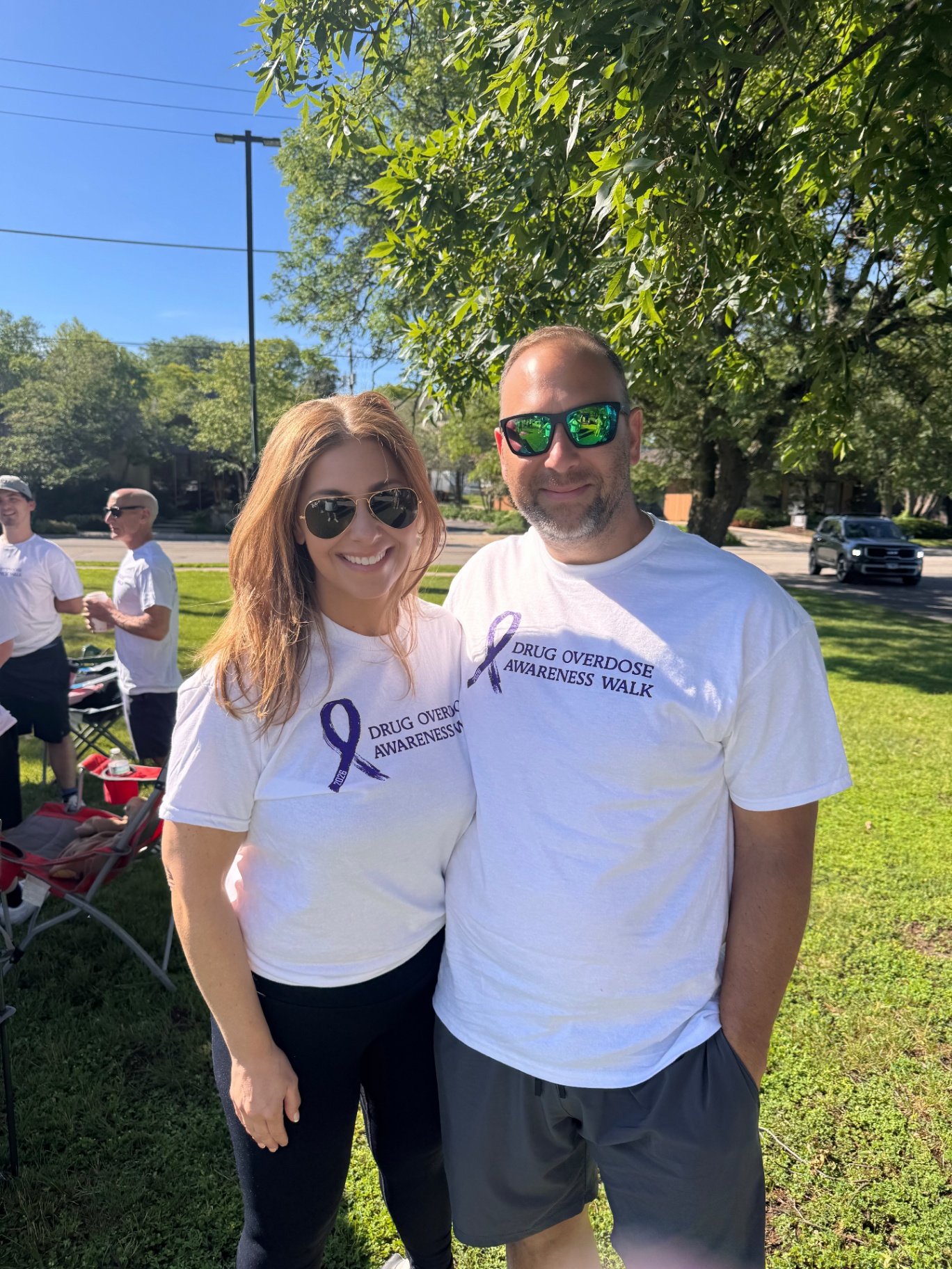 Two walkers in Drug Overdose Awareness Walk shirts